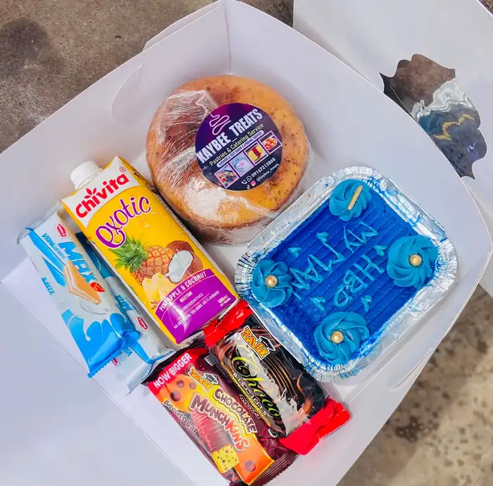 Surprise package with a blue bento cake, doughnut, juices and snacks